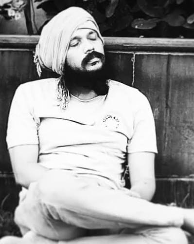 Kanth Risa seated in a contemplative pose